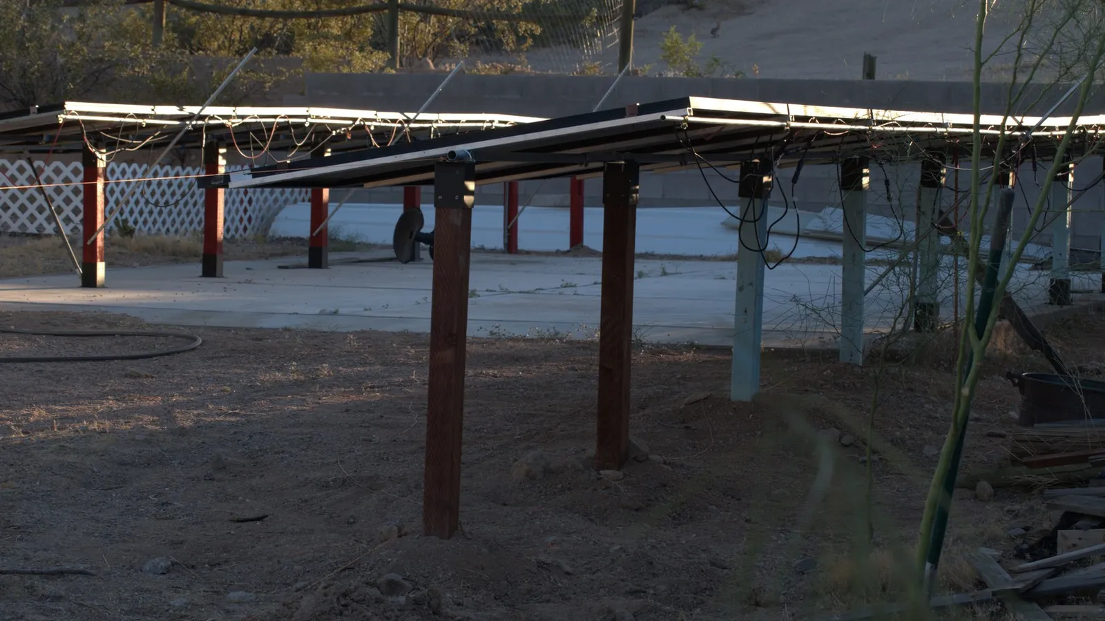 June 2024 shows the north and south panel rows with electrical wires hanging.