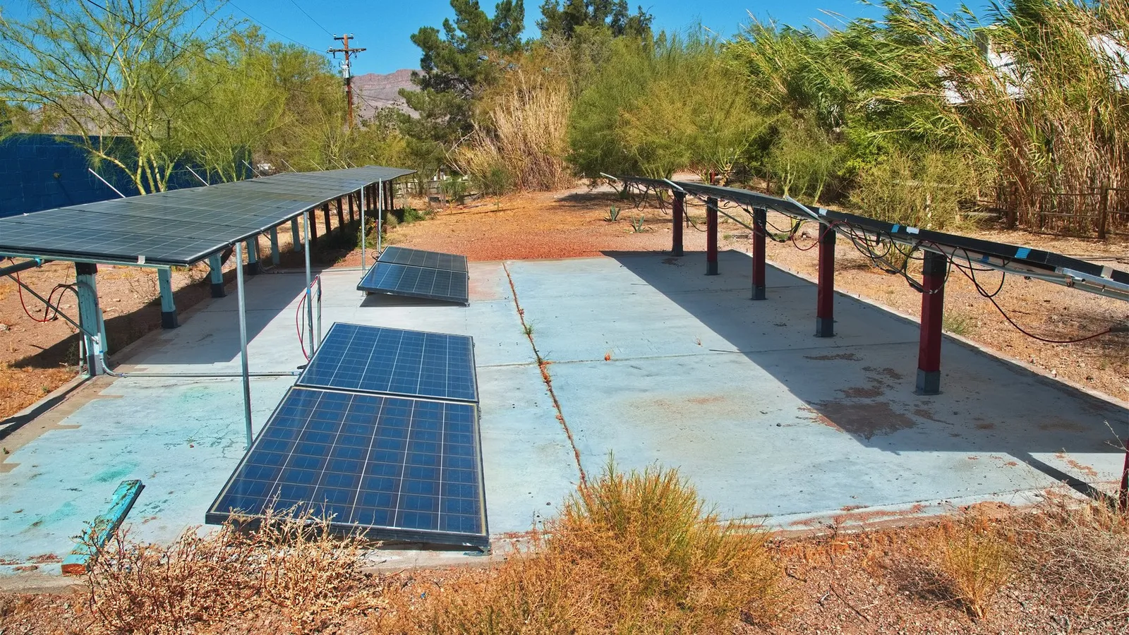 May 2026 Four panels were added to the center of the concrete pad. The shadow in the spring sun from the south panel row doesn't reach the panels in the middle row.