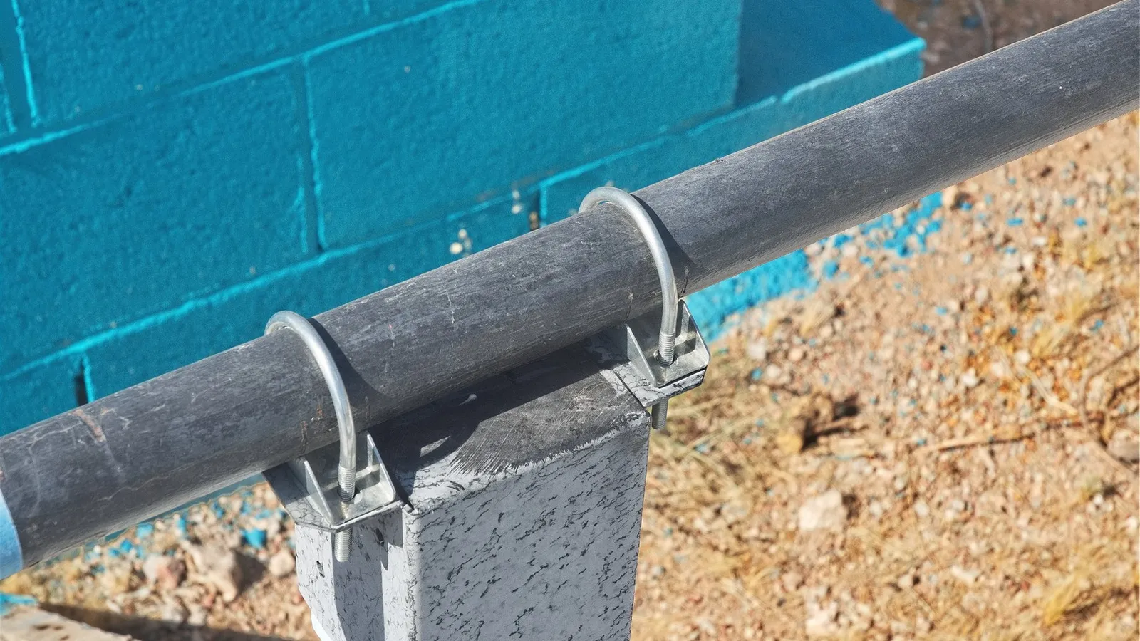 May 2026 The pipe is attached to the 4x4 treated post with these brackets and post tops. They are still holding up after two years of use.