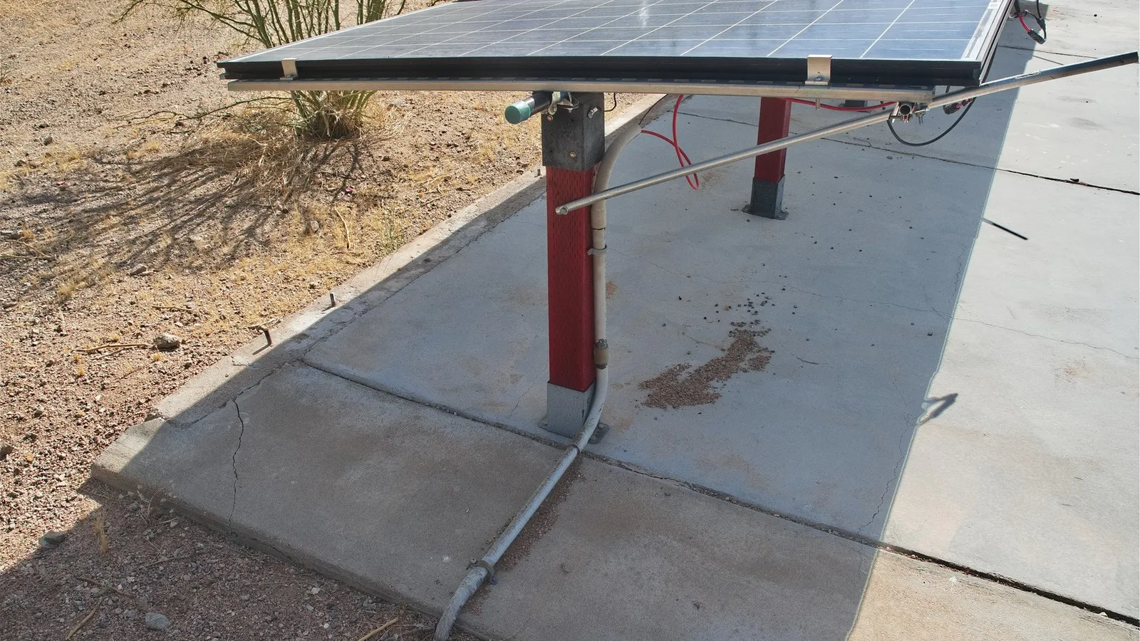 May 2026 The tilt is supported by 3/4-inch conduit tubing.  Buried PVC conduit holds the high-voltage wire going to the inverters.